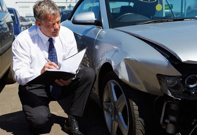 auto insurance accident report form on desk